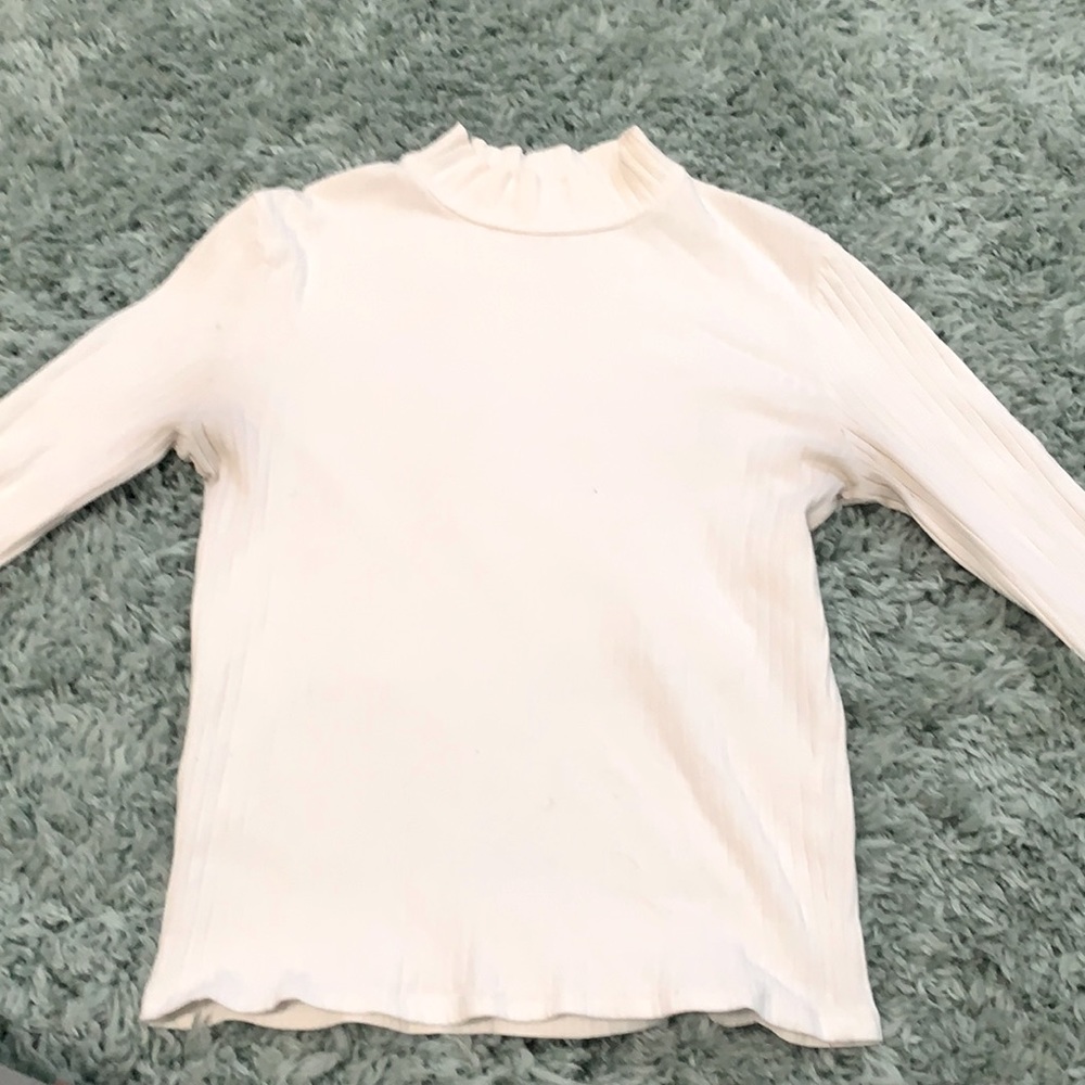 White turtleneck with striped dimensions